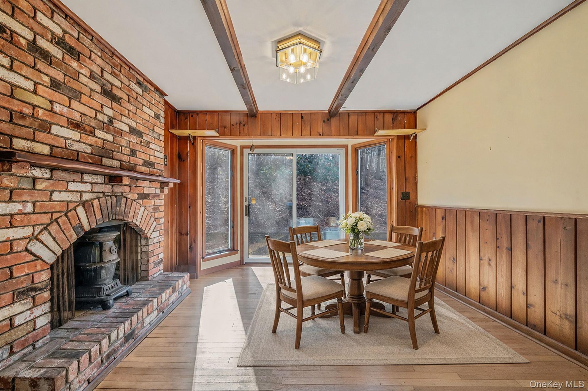 1 Spring Hollow Road Nissequogue, NY 11780 - Photo 6 of 17 a view of a dining room with furniture window and wooden floor