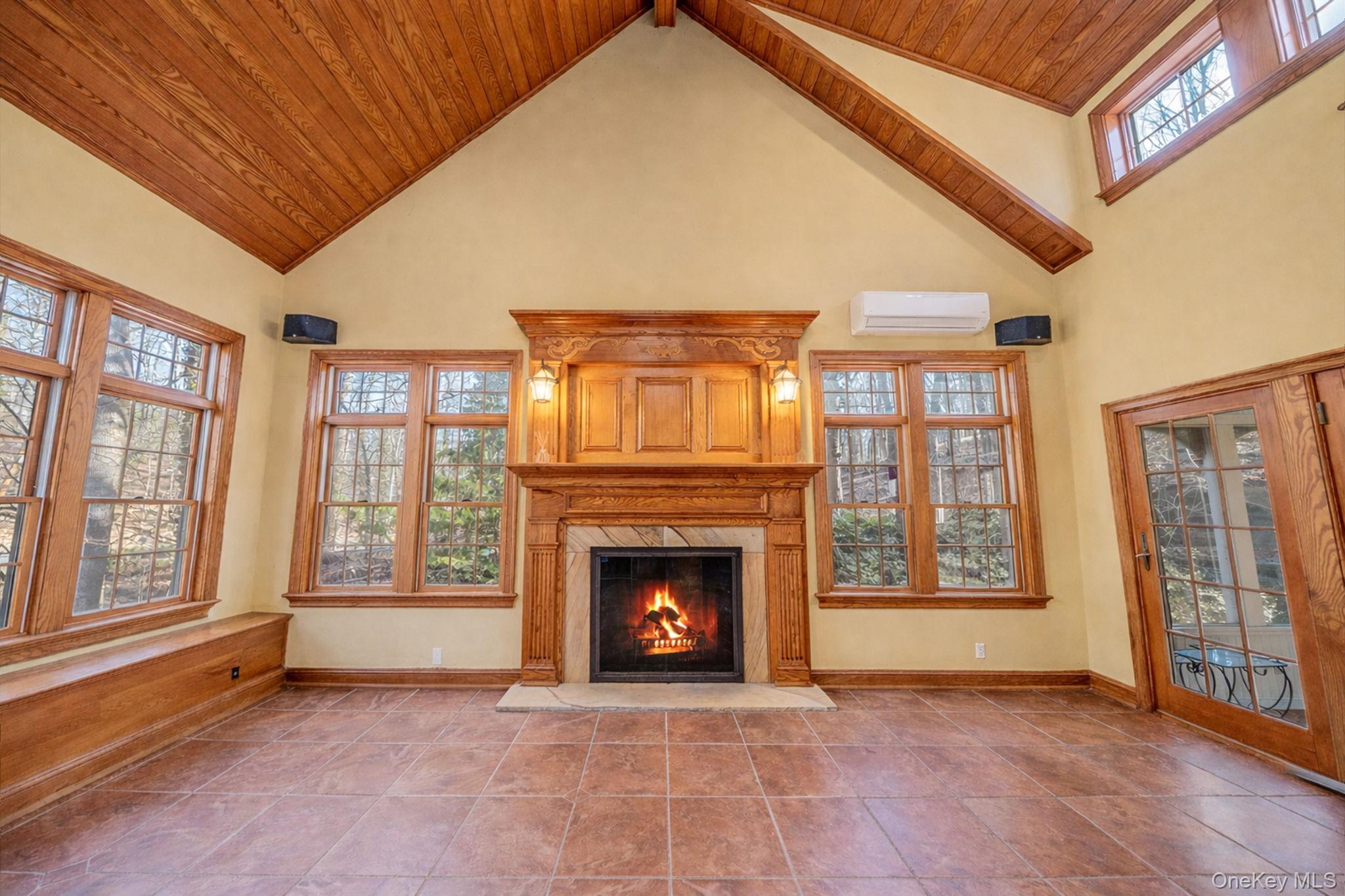 1 Spring Hollow Road Nissequogue, NY 11780 - Photo 8 of 17 a view of an empty room with a fireplace and a window