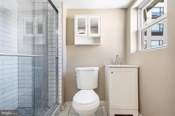 a bathroom with a toilet and a sink