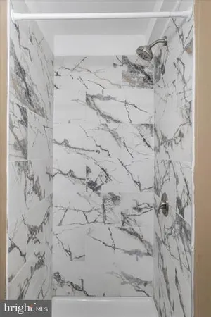 a bathroom with a sink a toilet a mirror and vanity