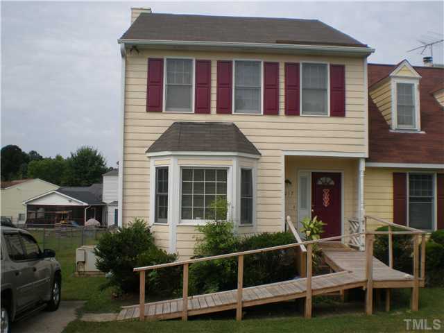 8017 Perry Creek Road Raleigh, NC 27616 - Photo 1 of 12 a front view of a house with windows