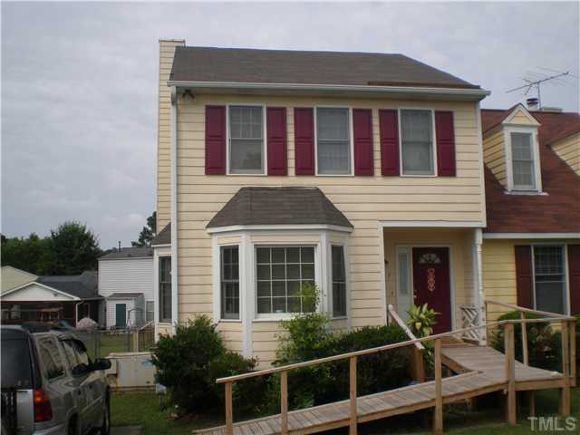 8017 Perry Creek Road Raleigh, NC 27616 - Photo 2 of 12 a front view of residential houses with stairs