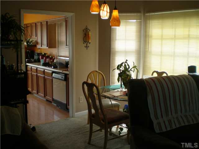 8017 Perry Creek Road Raleigh, NC 27616 - Photo 4 of 12 a dining room with furniture and window