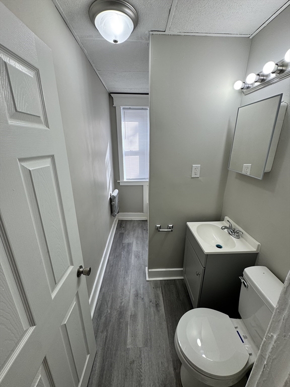 10 Marengo Park, Unit 3L Springfield, MA 01108 - Photo 7 of 8 a bathroom with a toilet sink and mirror