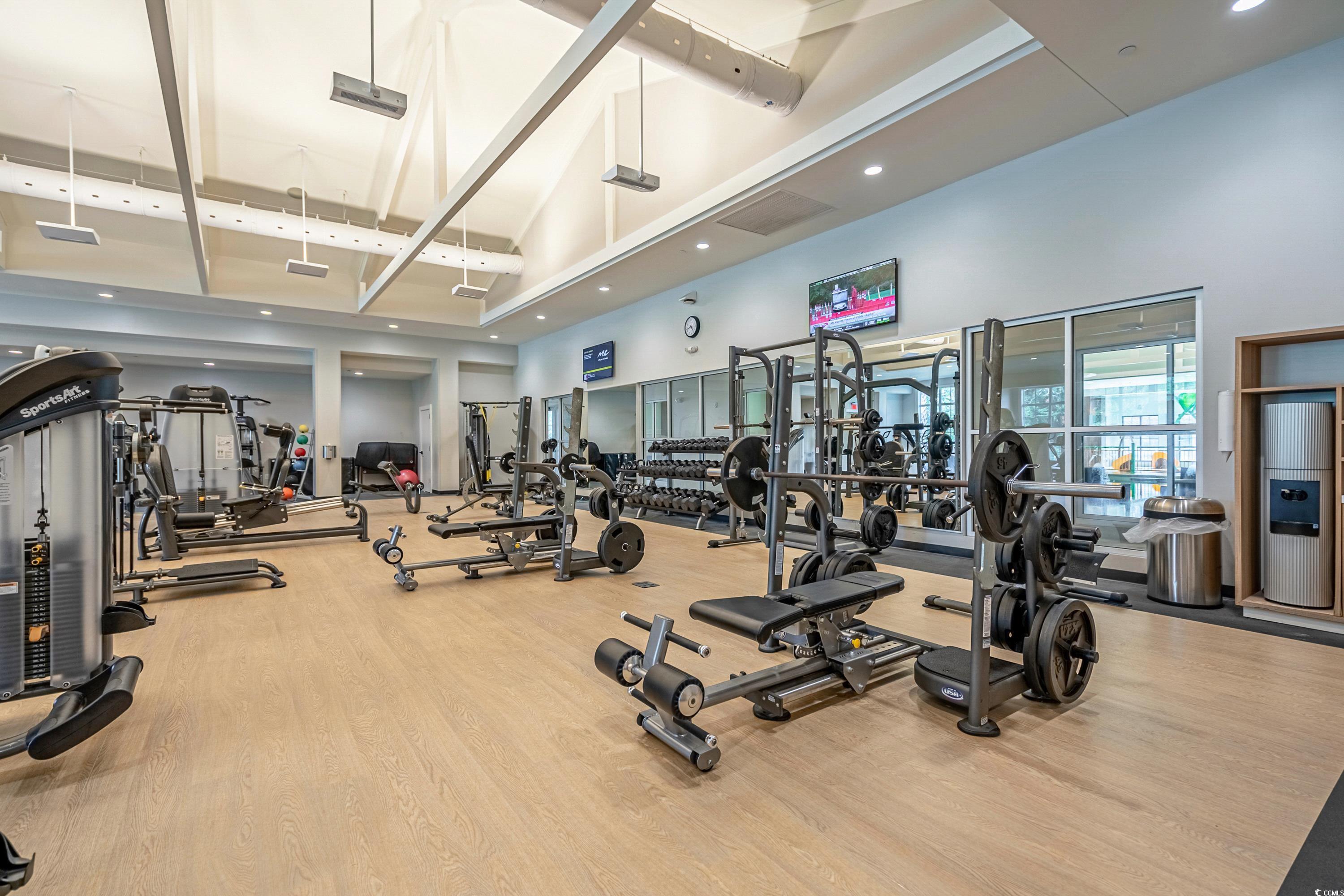 304 Cumberland Terrace, Unit 2F Myrtle Beach, SC 29572 - Photo 37 of 40 Workout area with high vaulted ceiling, beam ceiling, and recessed lighting