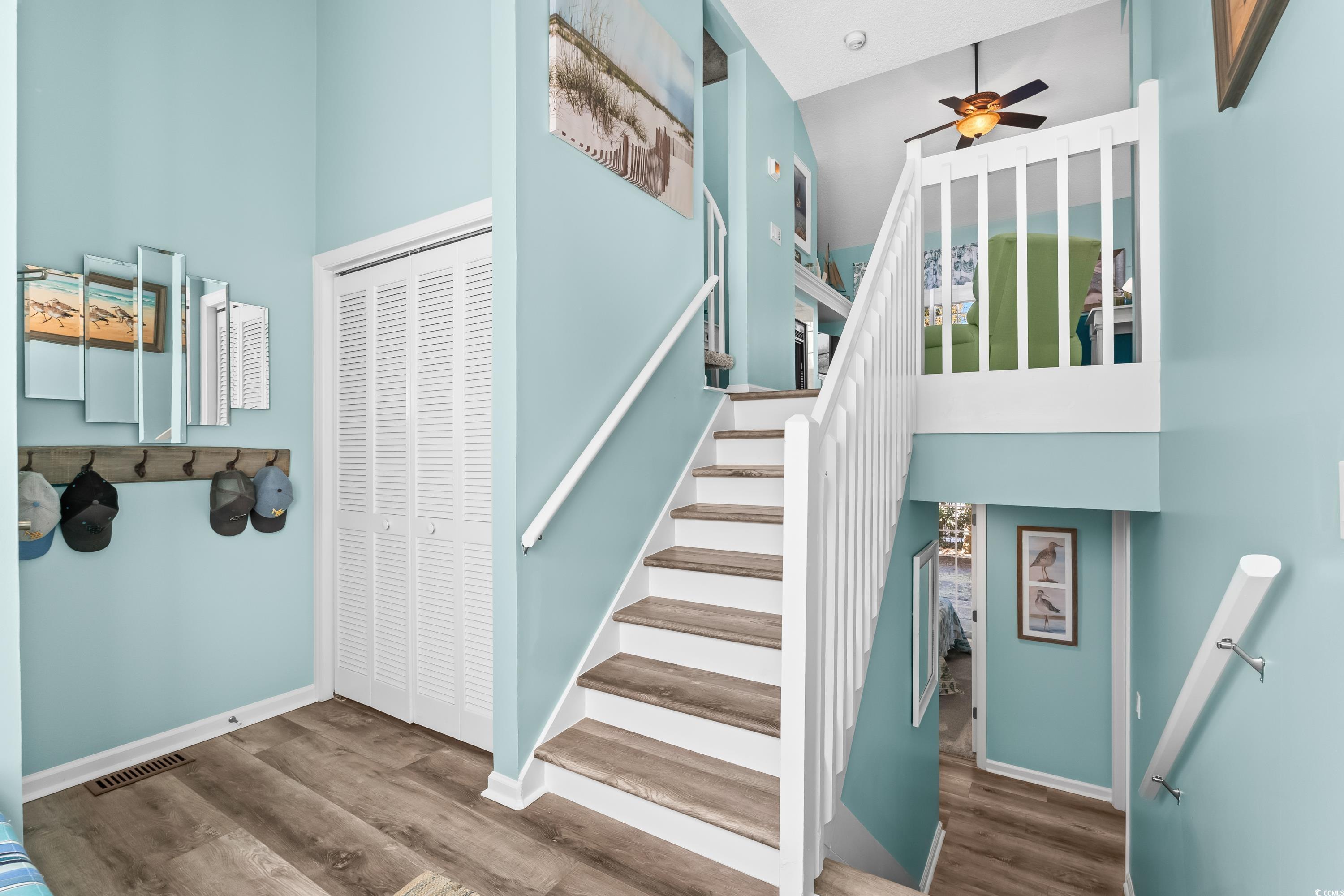 304 Cumberland Terrace, Unit 2F Myrtle Beach, SC 29572 - Photo 6 of 40 Staircase featuring wood finished floors and a ceiling fan