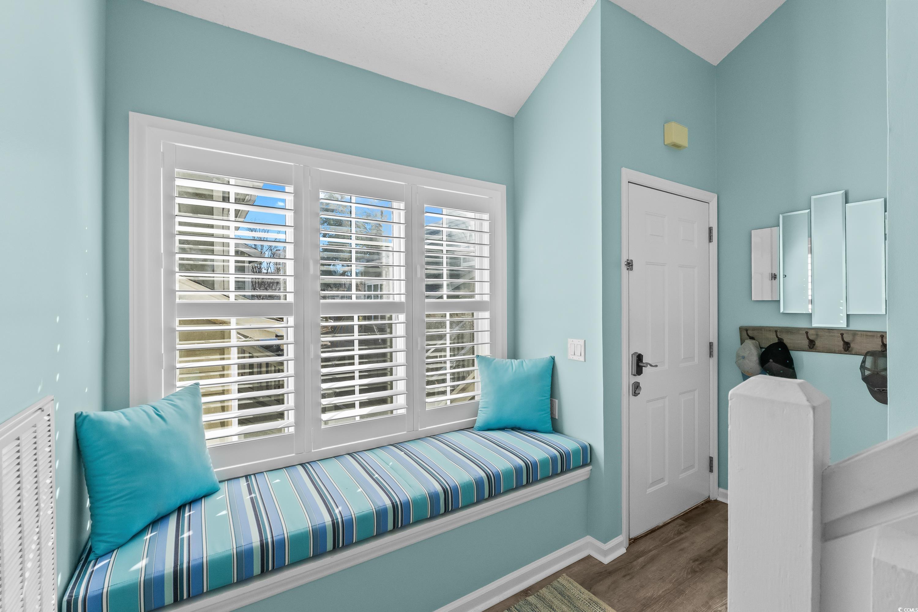 304 Cumberland Terrace, Unit 2F Myrtle Beach, SC 29572 - Photo 7 of 40 Sitting room with wood finished floors and baseboards
