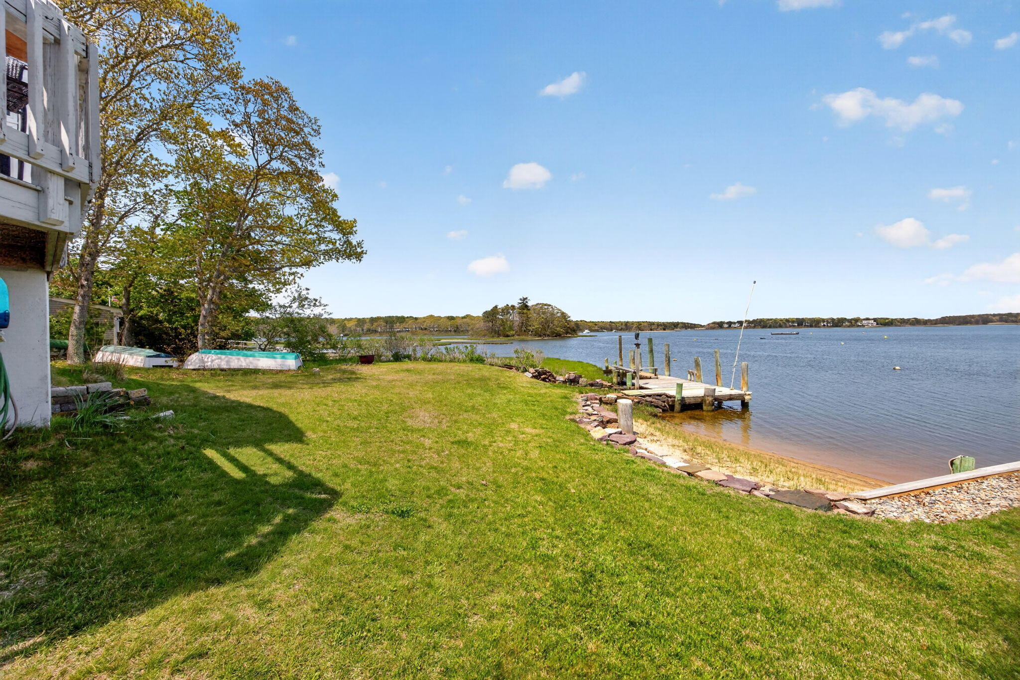 11 Clamshell Lane Mashpee, MA 02649 - Photo 30 of 43 a view of a lake with houses in the back