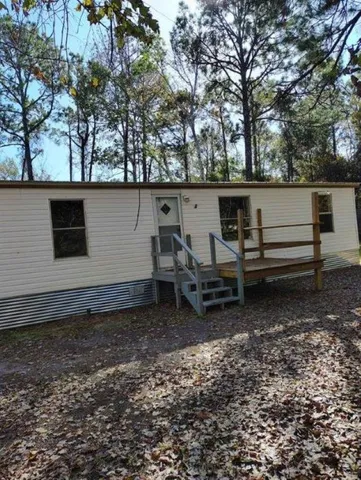 a view of a backyard with trees
