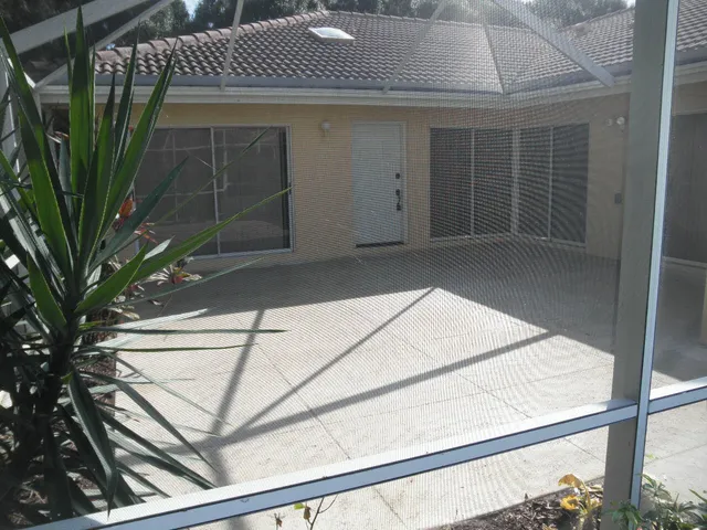 a view of backyard with a small cabin