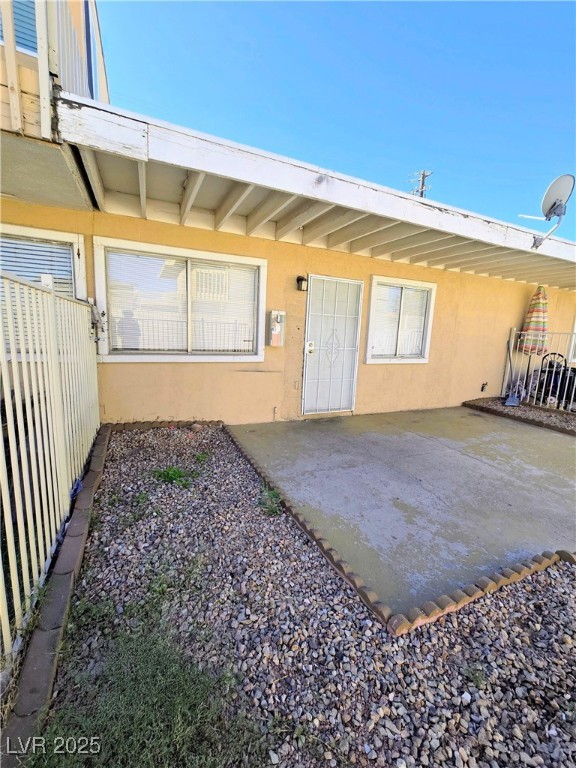908 North Jones Boulevard, Unit B Las Vegas, NV 89108 - Photo 26 of 28 Property entrance featuring stucco siding and a patio