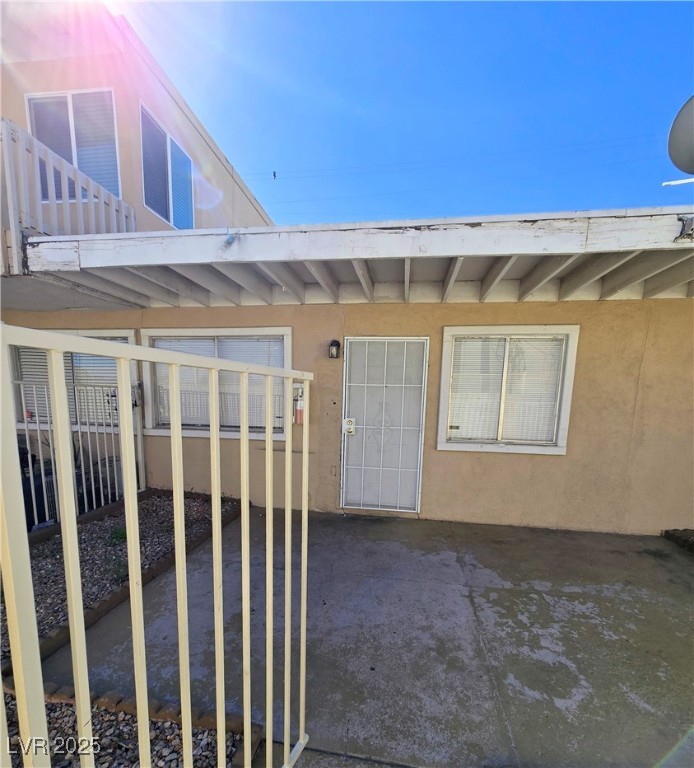 908 North Jones Boulevard, Unit B Las Vegas, NV 89108 - Photo 27 of 28 Entrance to property featuring stucco siding and a patio area