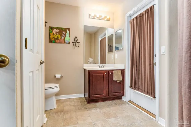 a view of walk in closet with clothes