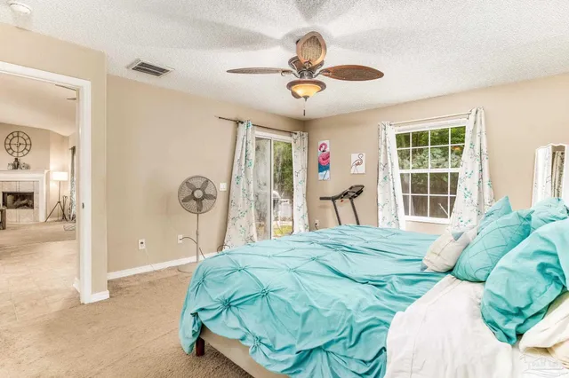 a view of a dining room with furniture and a chandelier