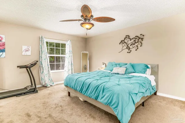 a living room with furniture and a large mirror