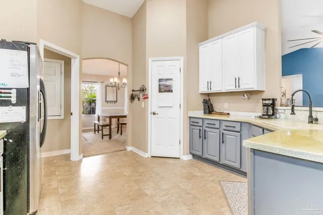 a building outdoor space with patio furniture and potted plants