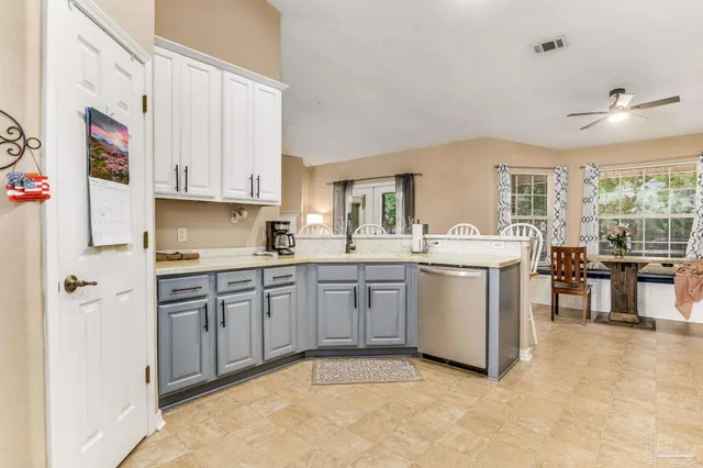 a view of a house with backyard and a slide