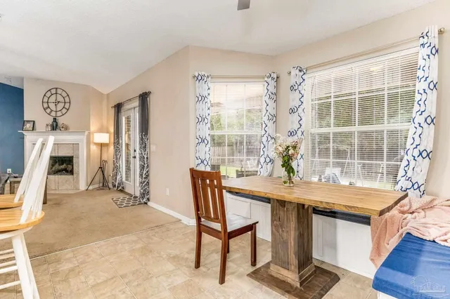 a view of a patio with couches chairs and a backyard