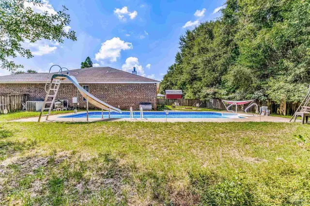 a bed room with a bed and a window