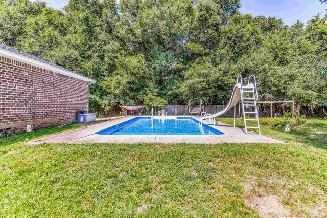 a utility room with cabinets washer and dryer