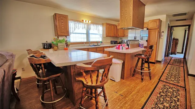 a living room with lots of furniture and a large window