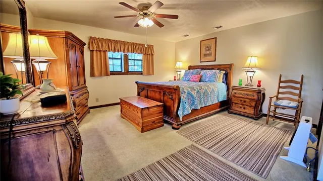 a dining room with furniture and a floor to ceiling window
