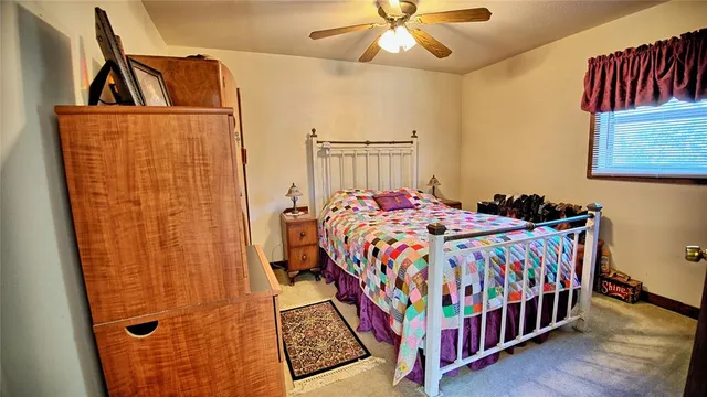 a bedroom with a bed and a table