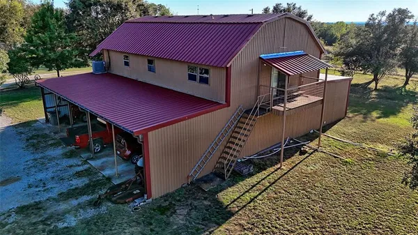 a aerial view of a house with a yard