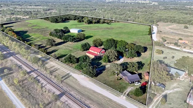 a view of a garden with an outdoor seating