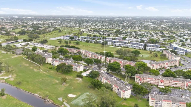 an aerial view of residential houses with city view