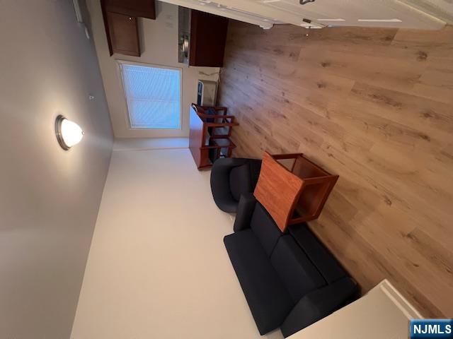 169 Barclay Street, Unit 105 Paterson, NJ 07503 - Photo 1 of 13 a living room with furniture and a wooden floor