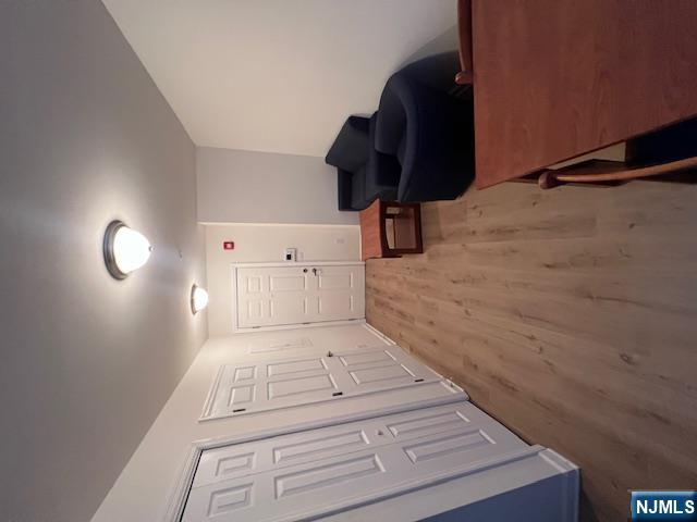 169 Barclay Street, Unit 105 Paterson, NJ 07503 - Photo 2 of 13 a living room with furniture and a wooden floor