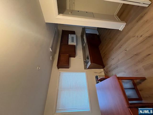 169 Barclay Street, Unit 105 Paterson, NJ 07503 - Photo 3 of 13 a room with furniture pool table and wooden floor