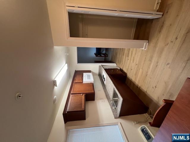 169 Barclay Street, Unit 105 Paterson, NJ 07503 - Photo 4 of 13 a large kitchen with stainless steel appliances granite countertop a stove and a refrigerator