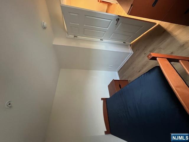 169 Barclay Street, Unit 105 Paterson, NJ 07503 - Photo 6 of 13 a view of an empty room and wooden floor