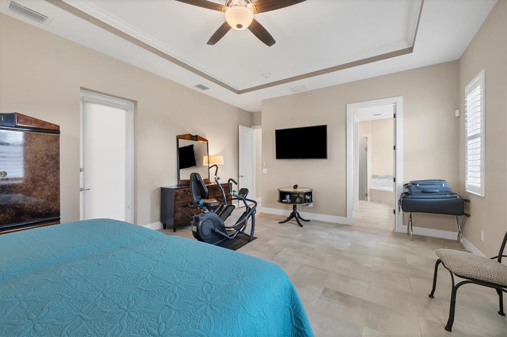 249 Rotonda Circle Rotonda West, FL 33947 - Photo 23 of 71 a bedroom with furniture a flat screen tv and a window