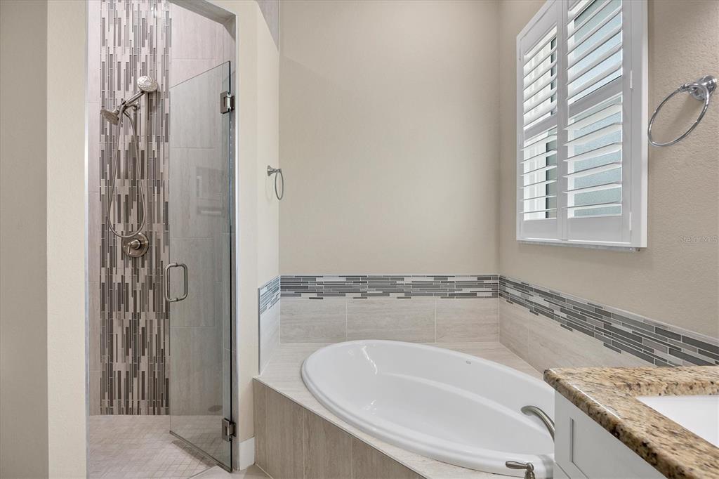 249 Rotonda Circle Rotonda West, FL 33947 - Photo 25 of 71 a bathroom with a granite countertop sink and a shower