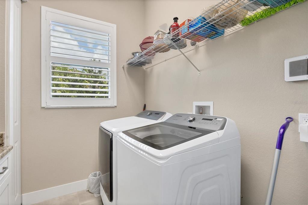 249 Rotonda Circle Rotonda West, FL 33947 - Photo 37 of 71 a utility room with dryer and washer