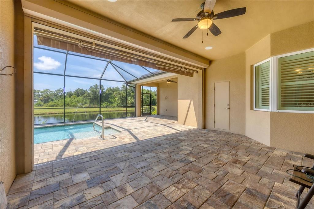 249 Rotonda Circle Rotonda West, FL 33947 - Photo 39 of 71 a view of a bedroom with a bed and wooden floor