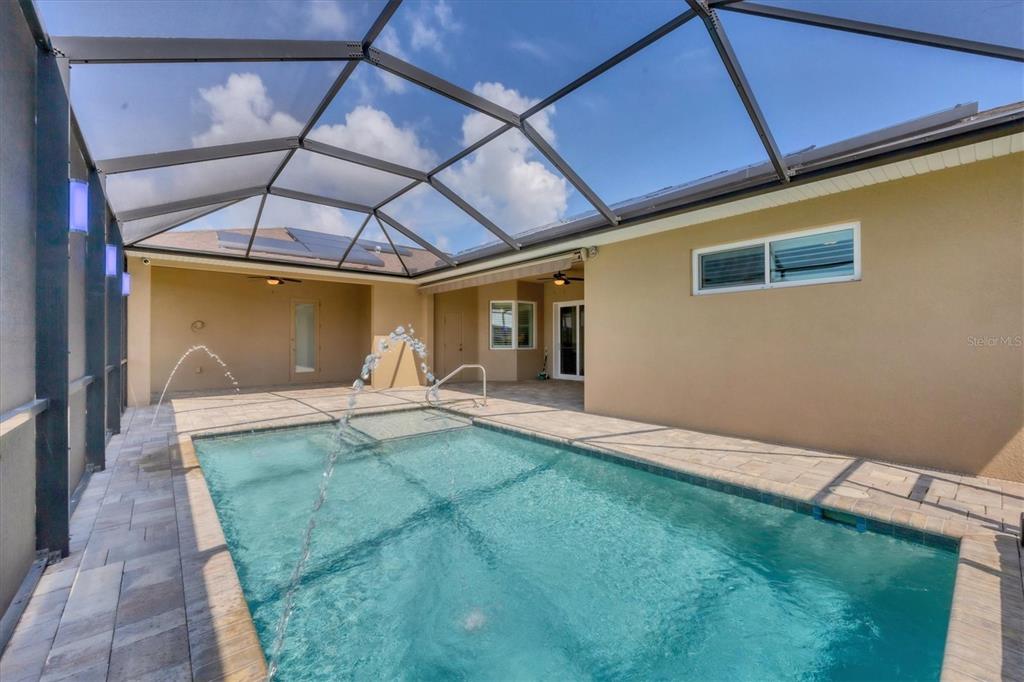 249 Rotonda Circle Rotonda West, FL 33947 - Photo 44 of 71 a view of a backyard with a small cabin