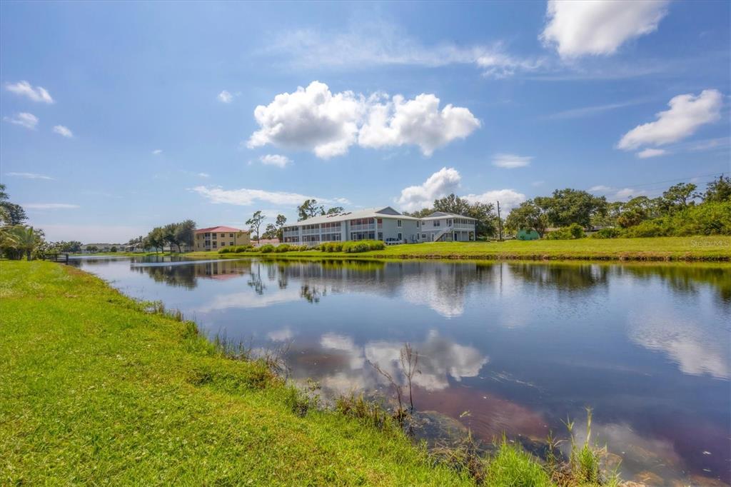 249 Rotonda Circle Rotonda West, FL 33947 - Photo 46 of 71 a view of a lake with a city