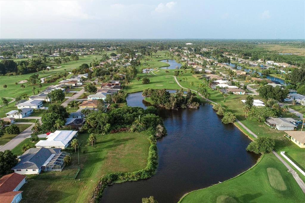 249 Rotonda Circle Rotonda West, FL 33947 - Photo 65 of 71 an aerial view of residential houses with outdoor space and trees