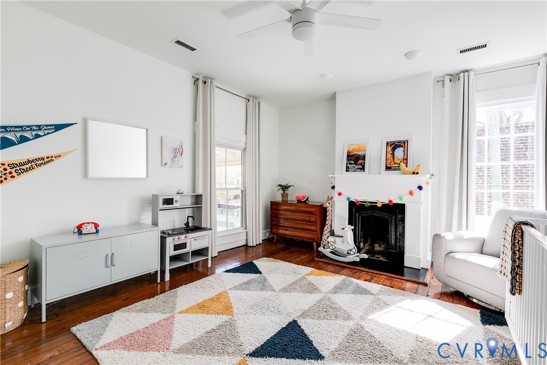 307 North 31st Street Richmond, VA 23223 - Photo 29 of 45 a living room with furniture and a fireplace