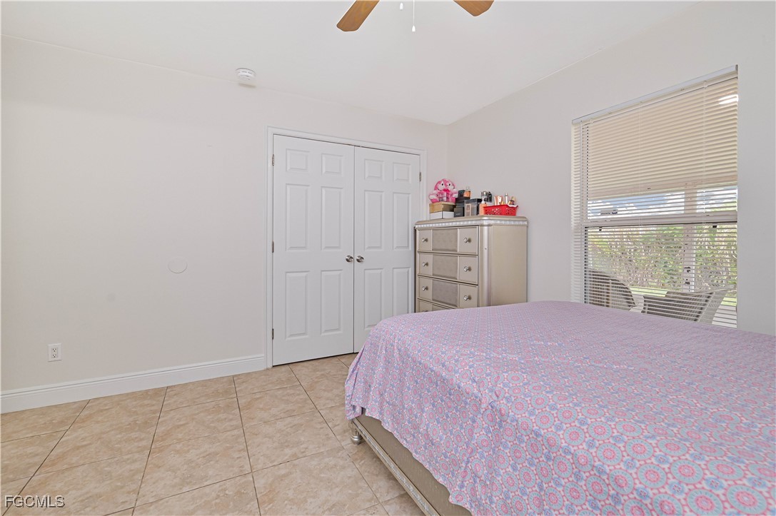 721-723 Homer Avenue South, Unit 723 Lehigh Acres, FL 33973 - Photo 14 of 36 a bedroom with a bed and a window