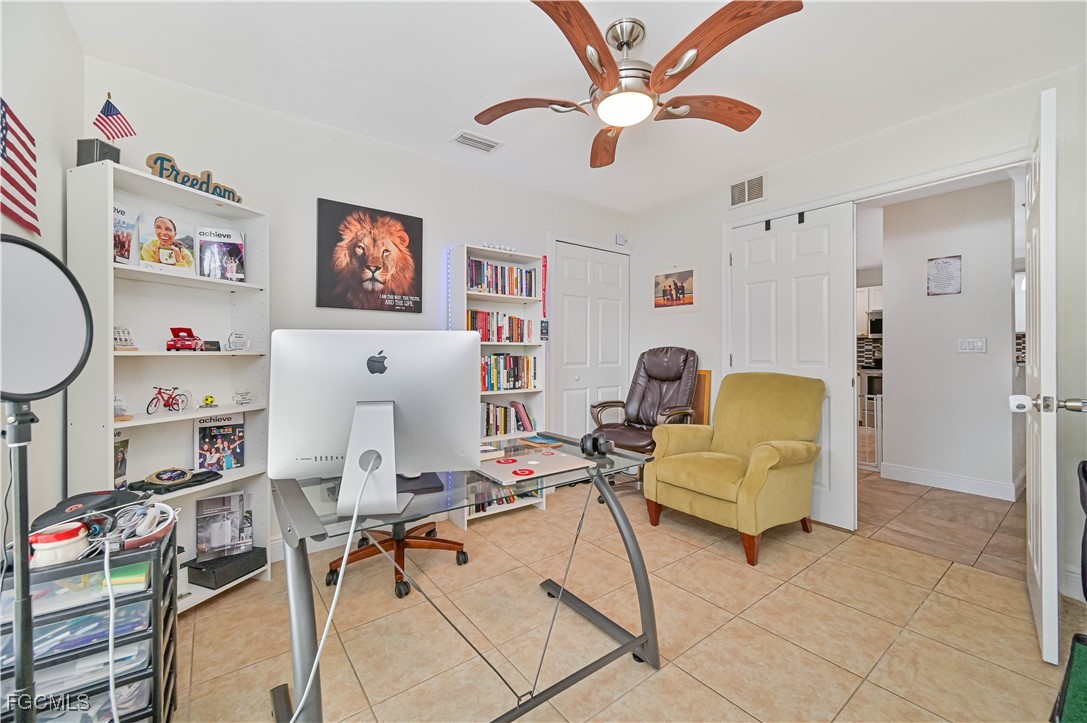 721-723 Homer Avenue South, Unit 723 Lehigh Acres, FL 33973 - Photo 16 of 36 a living room with furniture and a flat screen tv