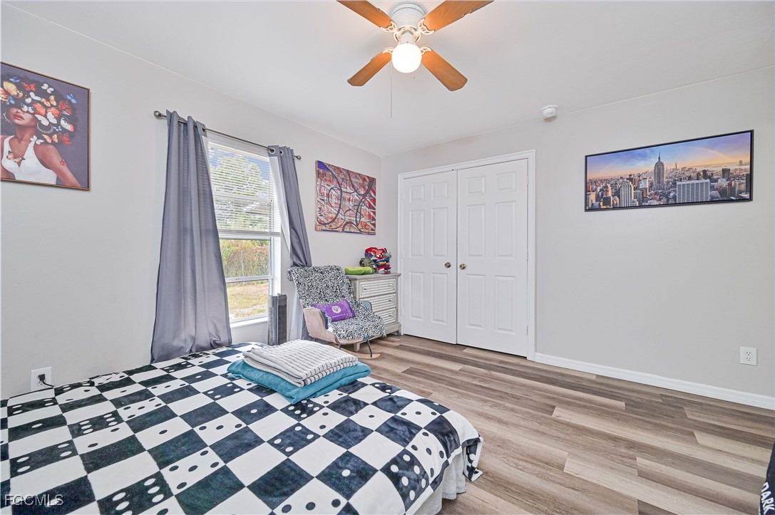 721-723 Homer Avenue South, Unit 723 Lehigh Acres, FL 33973 - Photo 30 of 36 a bedroom with a bed and a window