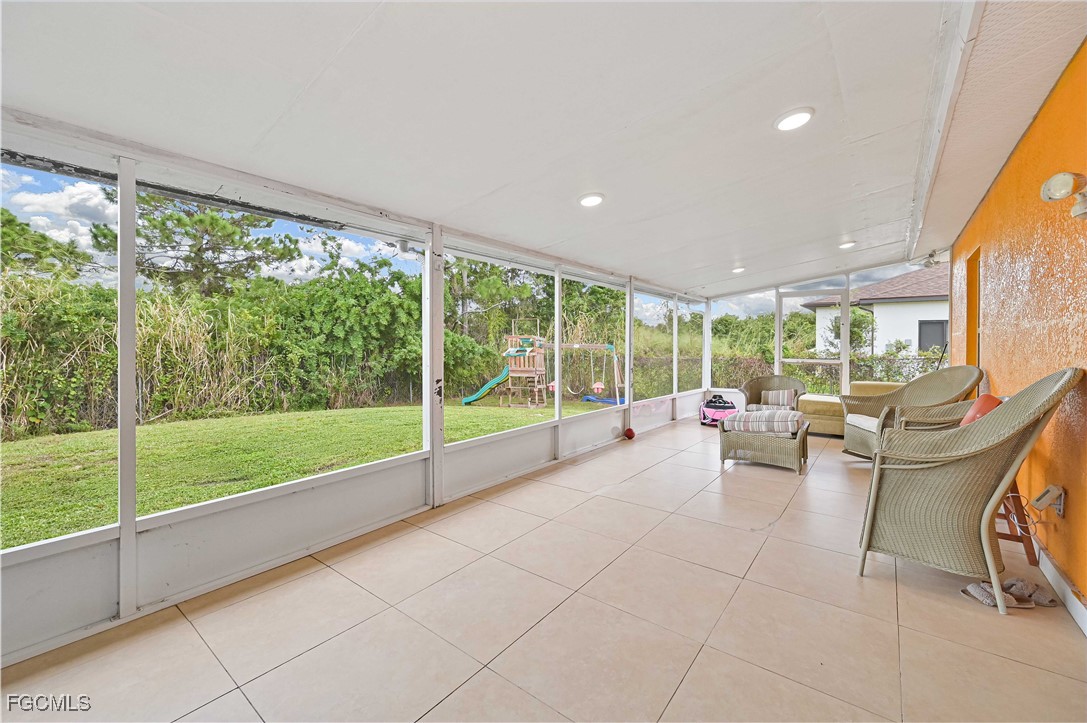721-723 Homer Avenue South, Unit 723 Lehigh Acres, FL 33973 - Photo 3 of 36 a view of a living room and floor to ceiling window