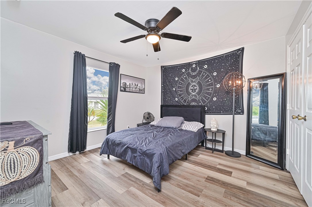 721-723 Homer Avenue South, Unit 723 Lehigh Acres, FL 33973 - Photo 35 of 36 a bedroom with a bed and window