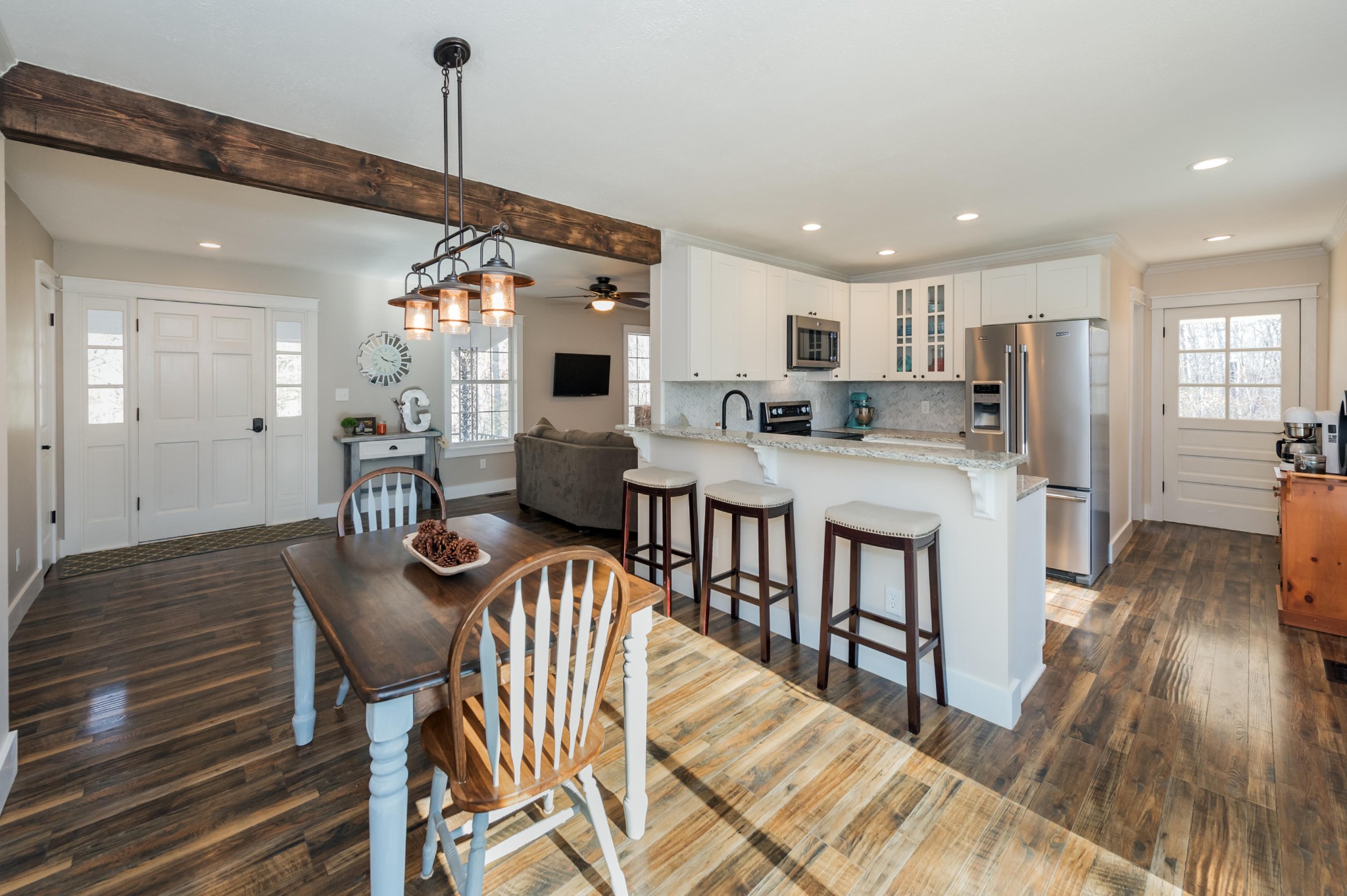 2324 Branch Road Loudon, TN 37774 - Photo 3 of 27 a view of a dining room and livingroom with furniture wooden floor a rug a chandelier