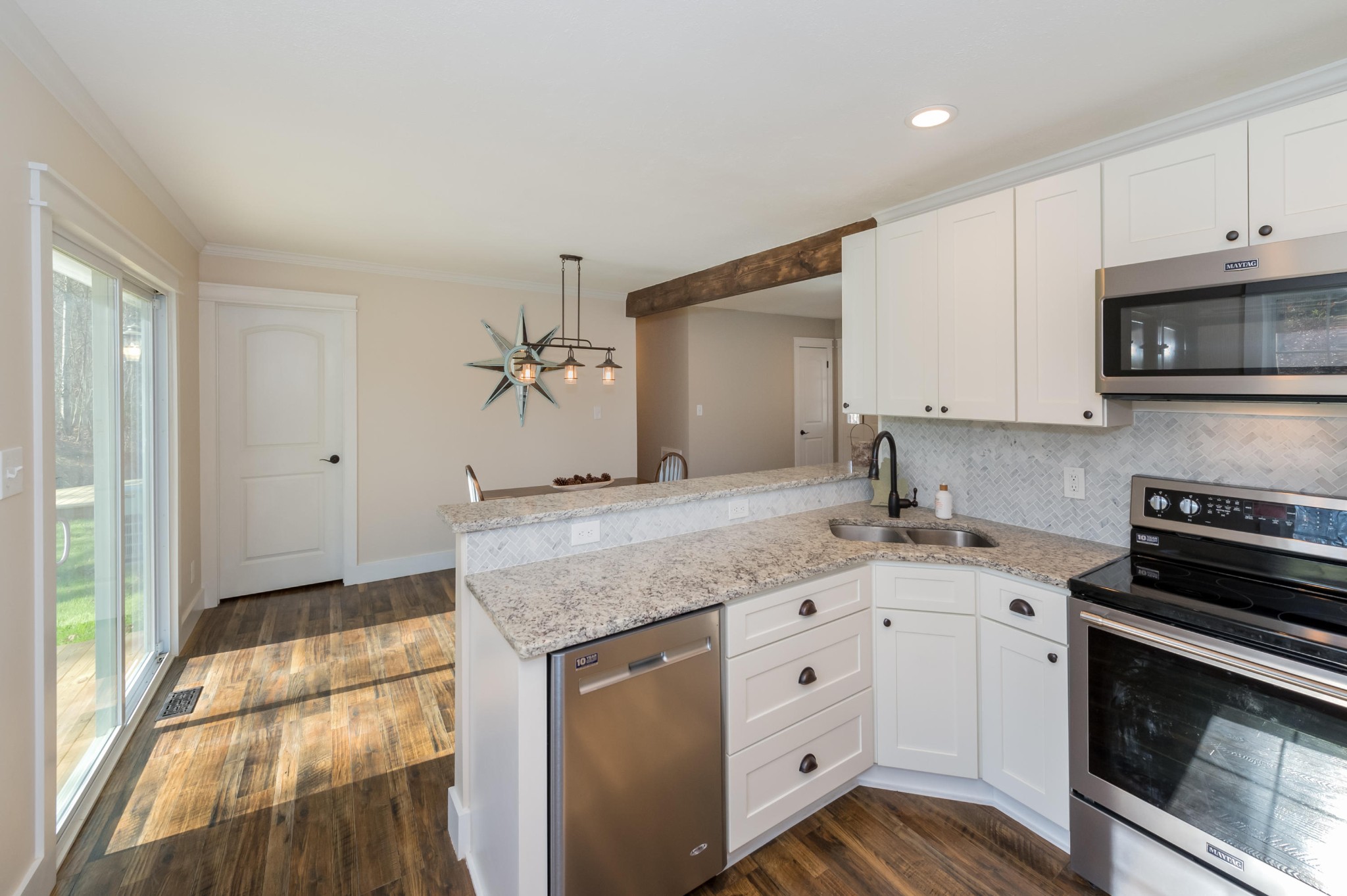 2324 Branch Road Loudon, TN 37774 - Photo 7 of 27 a kitchen with granite countertop a sink stove and cabinets